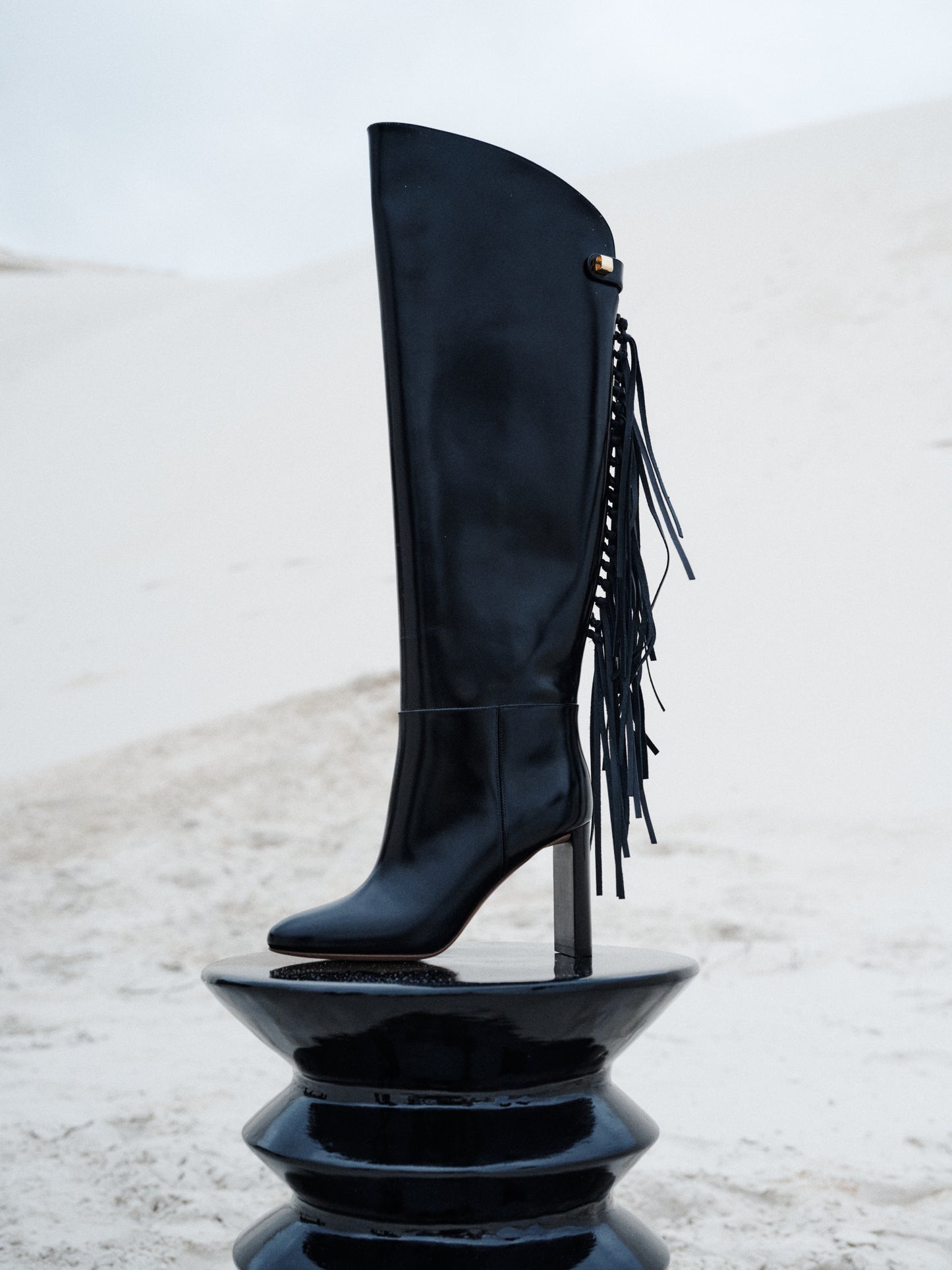 Adriana Calypso High-Heel black leather boots with fringes