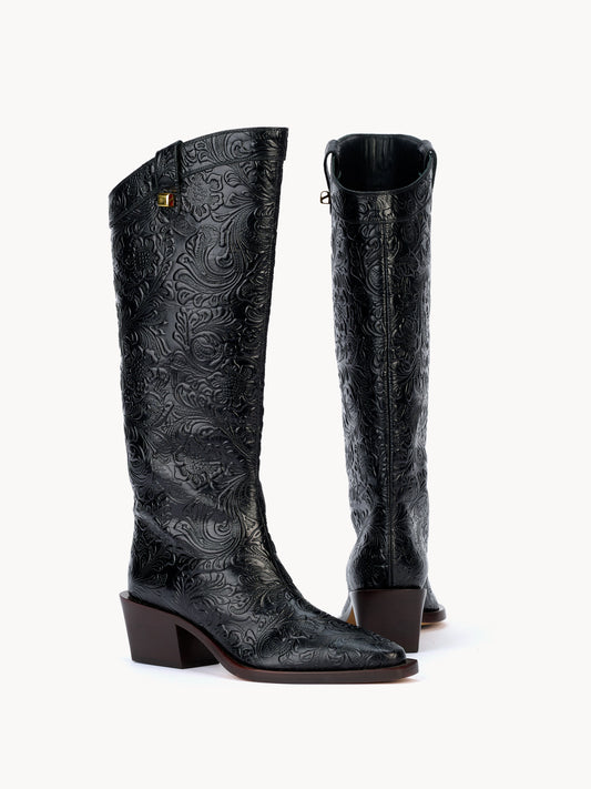 Santiag western boots in black embossed floral leather by Adriana Abascal Filiberto de Saboya