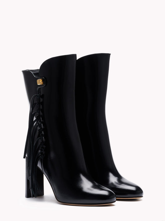 Luxury fringed patent leather ankle boots made in Italy by Adriana Abascal at Maison Skorpios